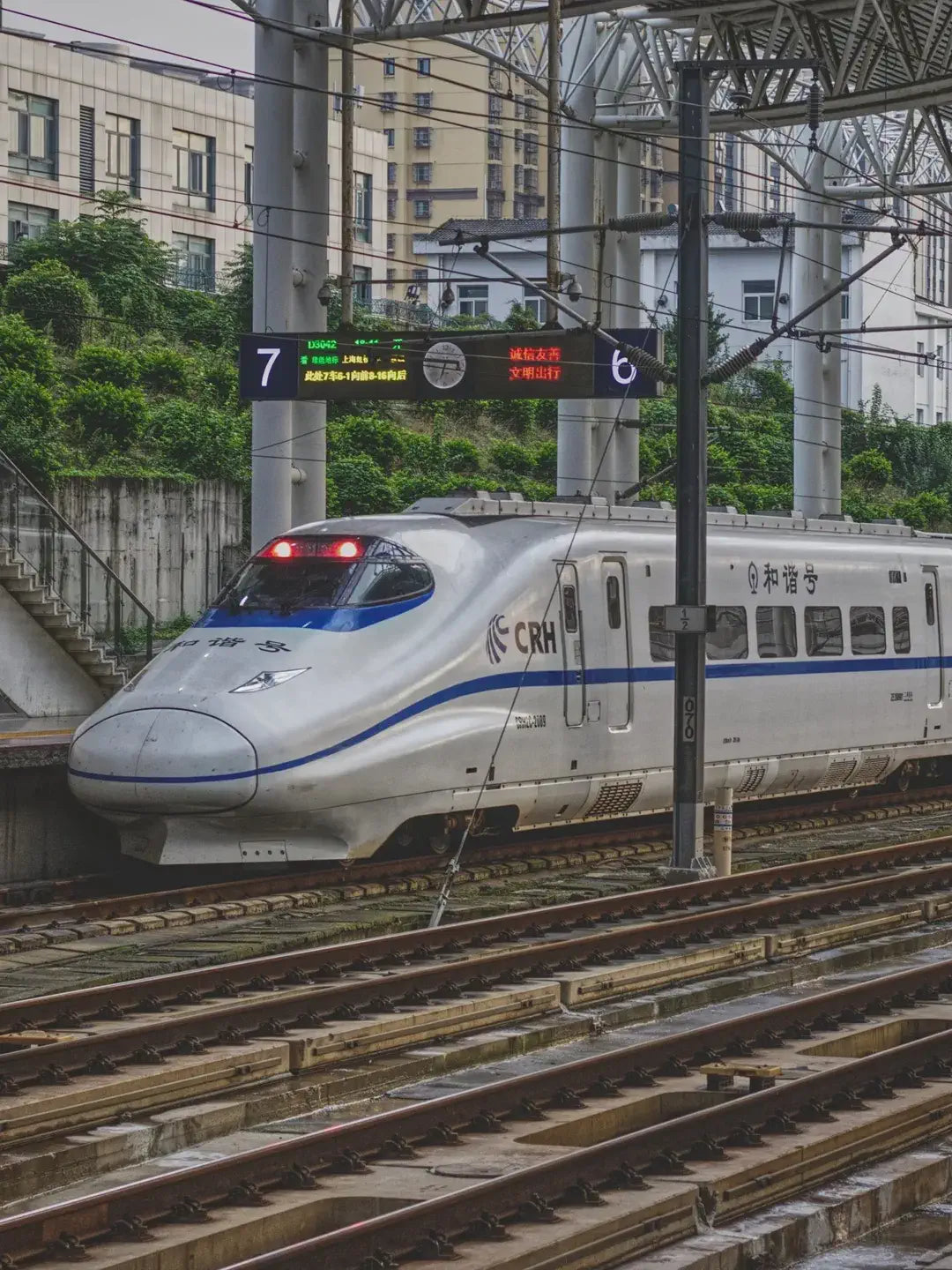 High-speed train arriving at Shanghai Hongqiao Railway Station, modern transportation hub and platform