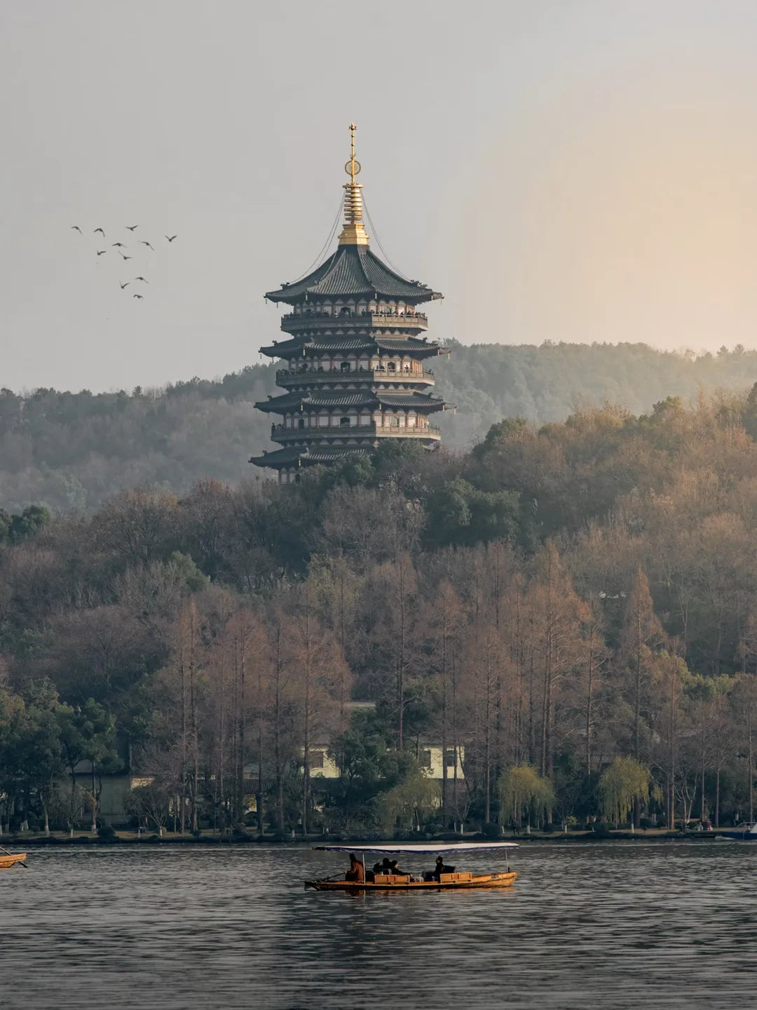 West Lake hand-rowed boat tour towards Mid-Lake Pavilion