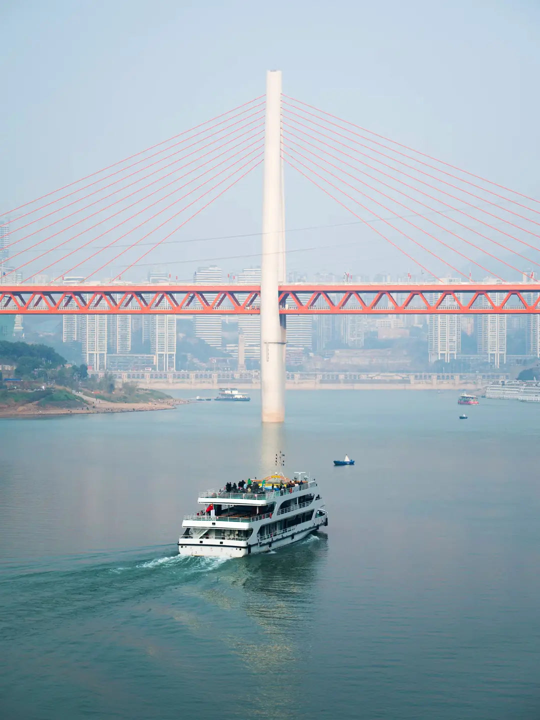 Yangtze cruise ship passing under bridge