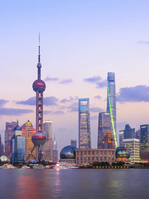 Shanghai Tower standing tall in Lujiazui financial district, modern skyscraper against blue sky